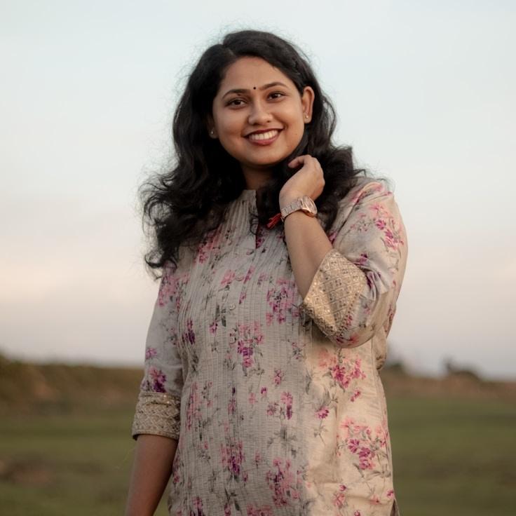 Aarav Singh, Lead Design Curator at BrightStoneCore, reviewing corporate floral arrangements